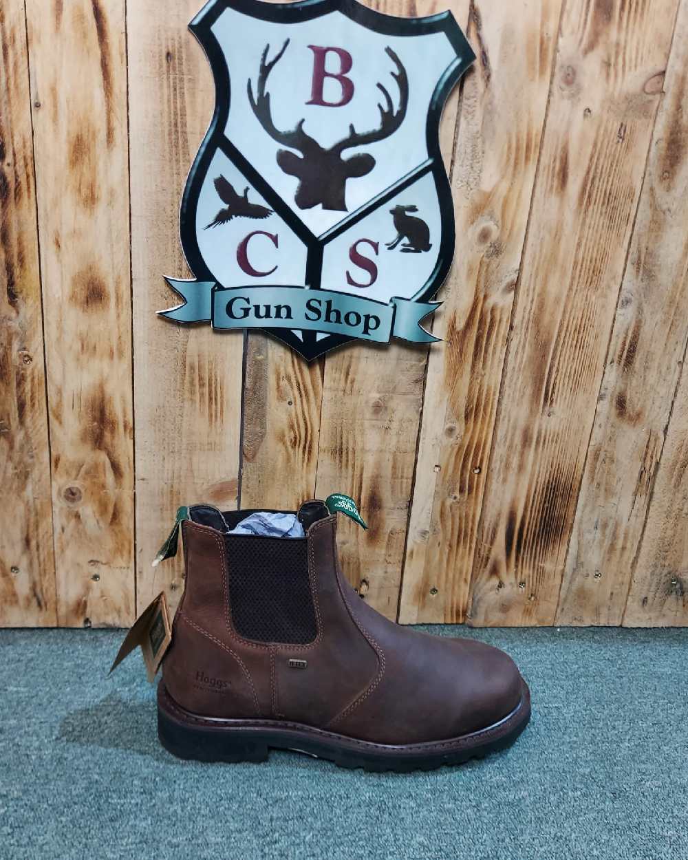 Crazy Horse Brown Coloured Hoggs of Fife Shire Pro Waterproof Dealer Boots on wood background 