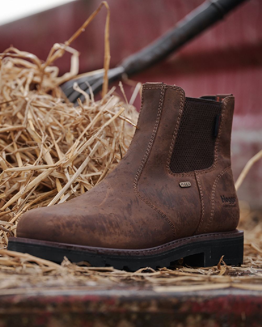 Crazy Horse Brown Coloured Hoggs of Fife Shire Pro Waterproof Dealer Boots on grass background 