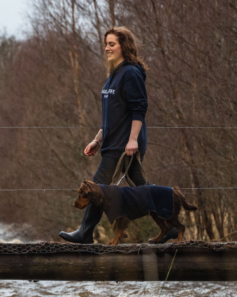Navy Coloured Hoggs of Fife Stenton Fleece Dog Coat on countryside background 