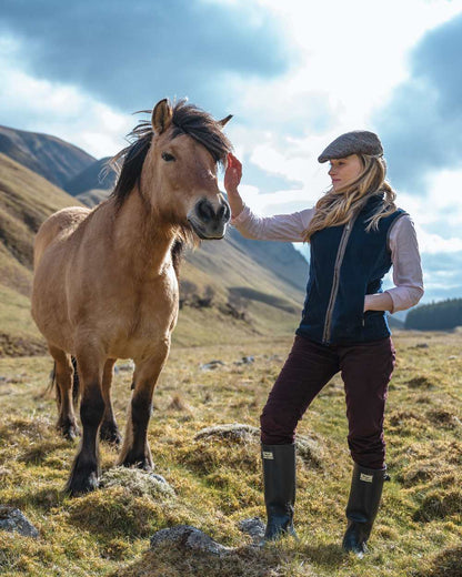 Midnight Navy Coloured Hoggs of Fife Stenton Ladies Fleece Gilet on mountain background 