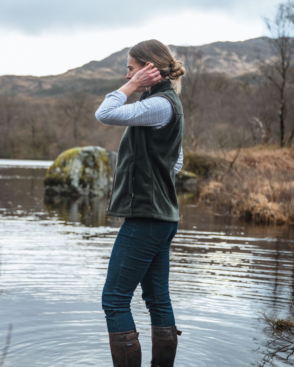 Pine Green Coloured Hoggs of Fife Stenton Ladies Fleece Gilet on mountain background 