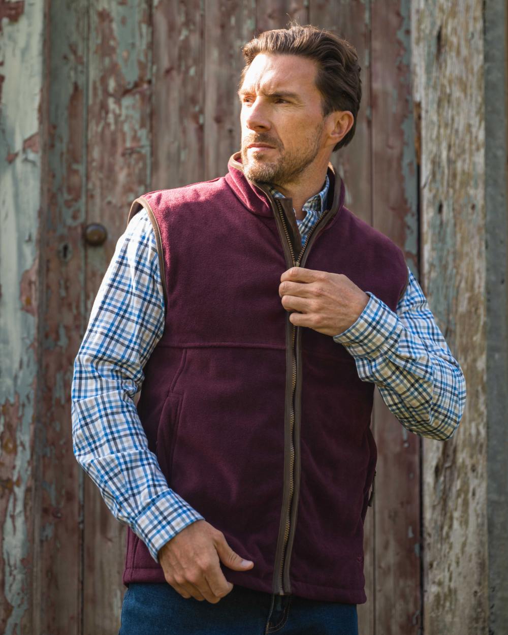 Merlot coloured Hoggs of Fife Stenton Technical Fleece Gilet on outdoor background 