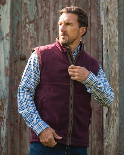 Merlot coloured Hoggs of Fife Stenton Technical Fleece Gilet on outdoor background 