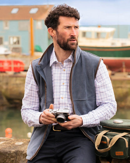 Slate Grey coloured Hoggs of Fife Stenton Technical Fleece Gilet on coastal background 