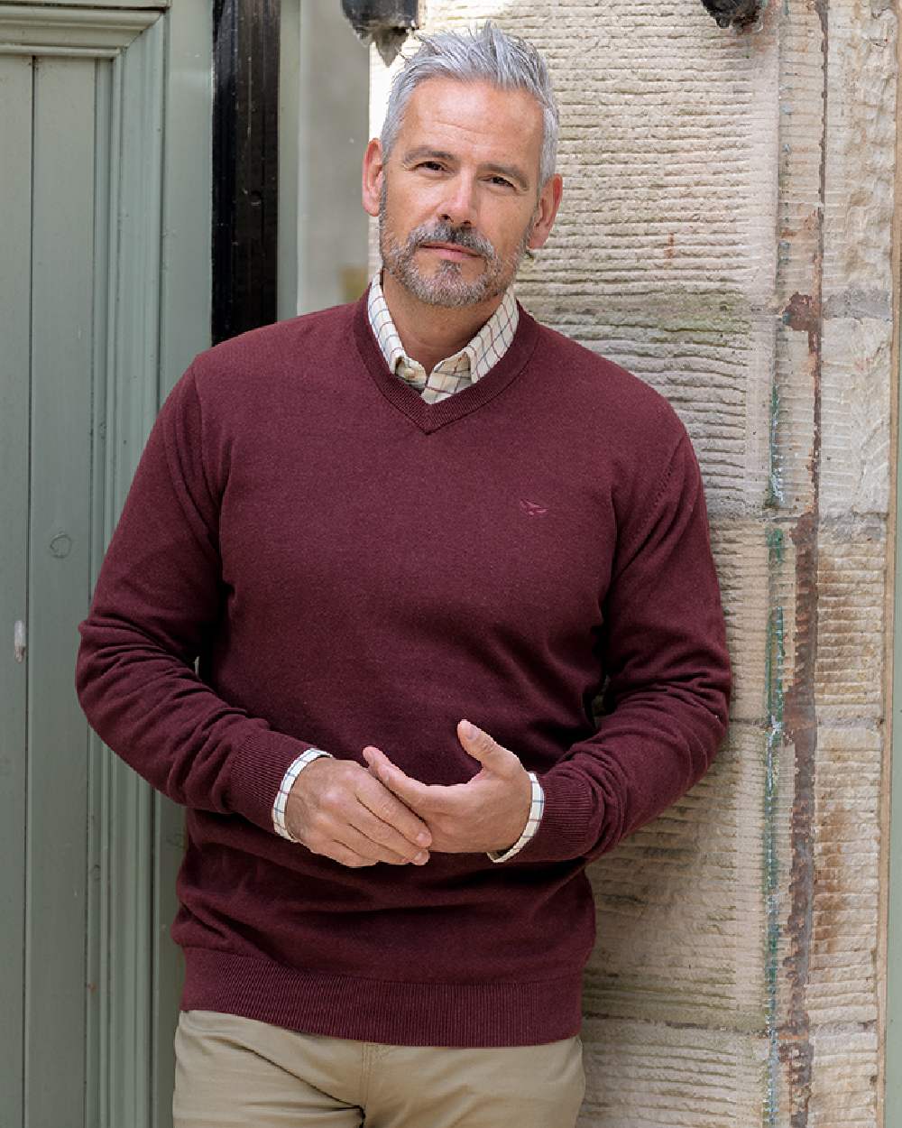 Berry Red Coloured Hoggs of Fife Stirling II Long Sleeve Pullover on wall background 
