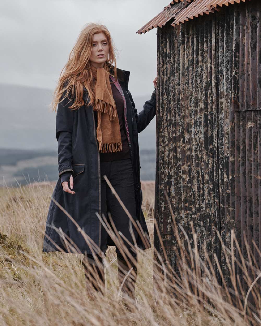 Navy Coloured Hoggs of Fife Struther Ladies Long Riding Coat on mountain background 