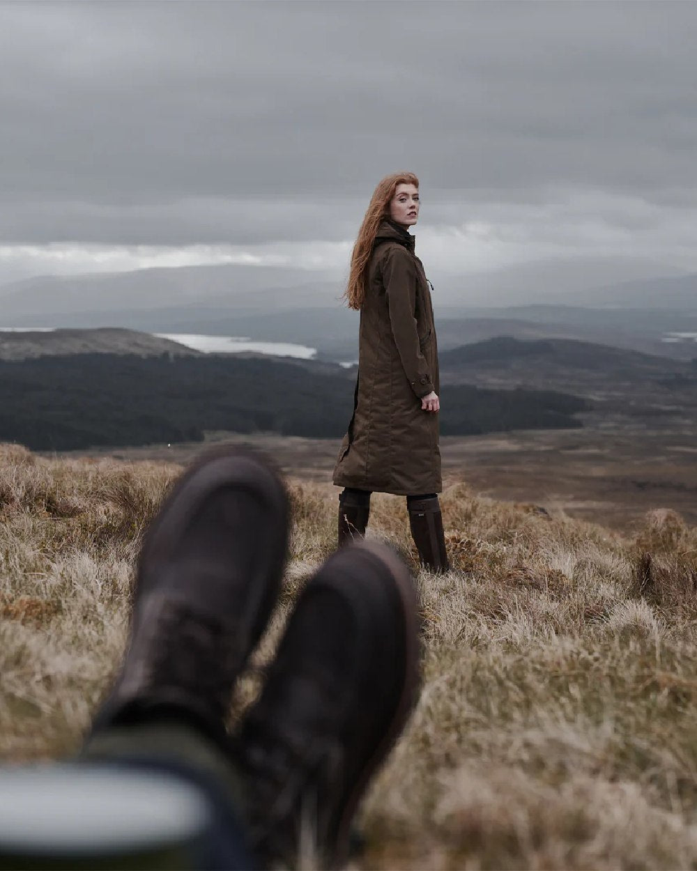 Sage Coloured Hoggs of Fife Struther Ladies Long Riding Coat on mountain background 