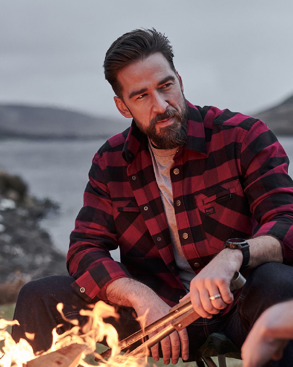 Red Black coloured Hoggs of Fife Tentsmuir Flannel Shirt on lake background 