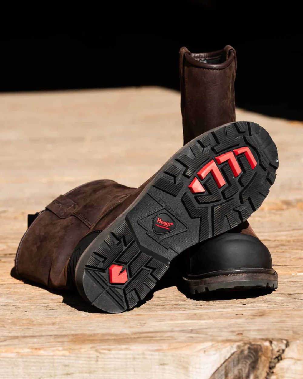 Brown Coloured Hoggs of Fife Thor Safety Rigger Boots on wood background 