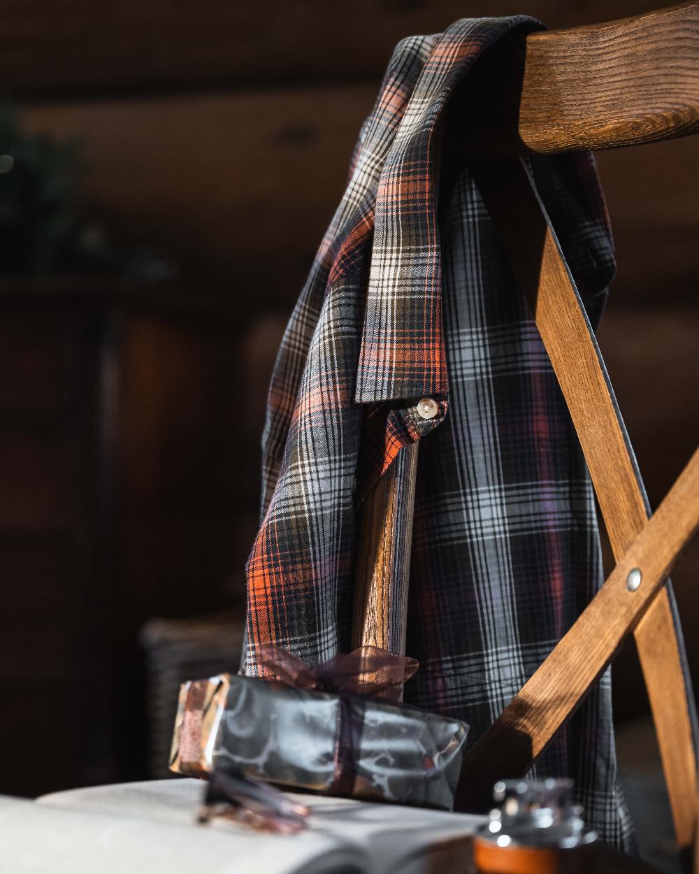 Rust Olive Navy coloured Hoggs of Fife Tiree Herringbone Check Shirt on indoor background 