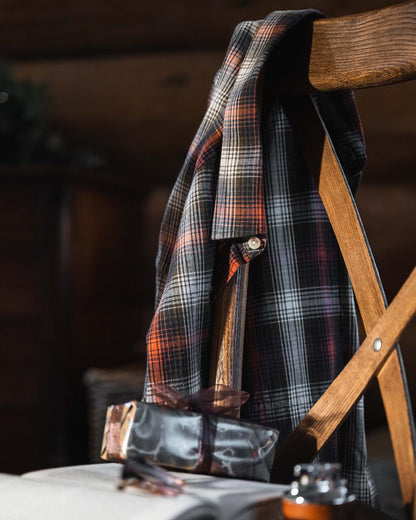 Rust Olive Navy coloured Hoggs of Fife Tiree Herringbone Check Shirt on indoor background 