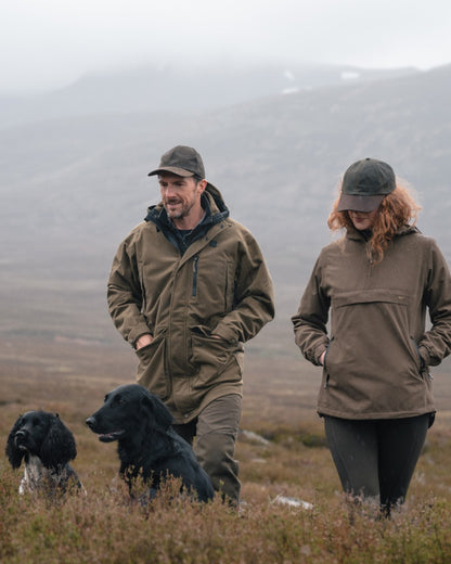 Olive coloured Hoggs of Fife Mens Torness Trilaminate 3-In-1 Jacket on moorland background 