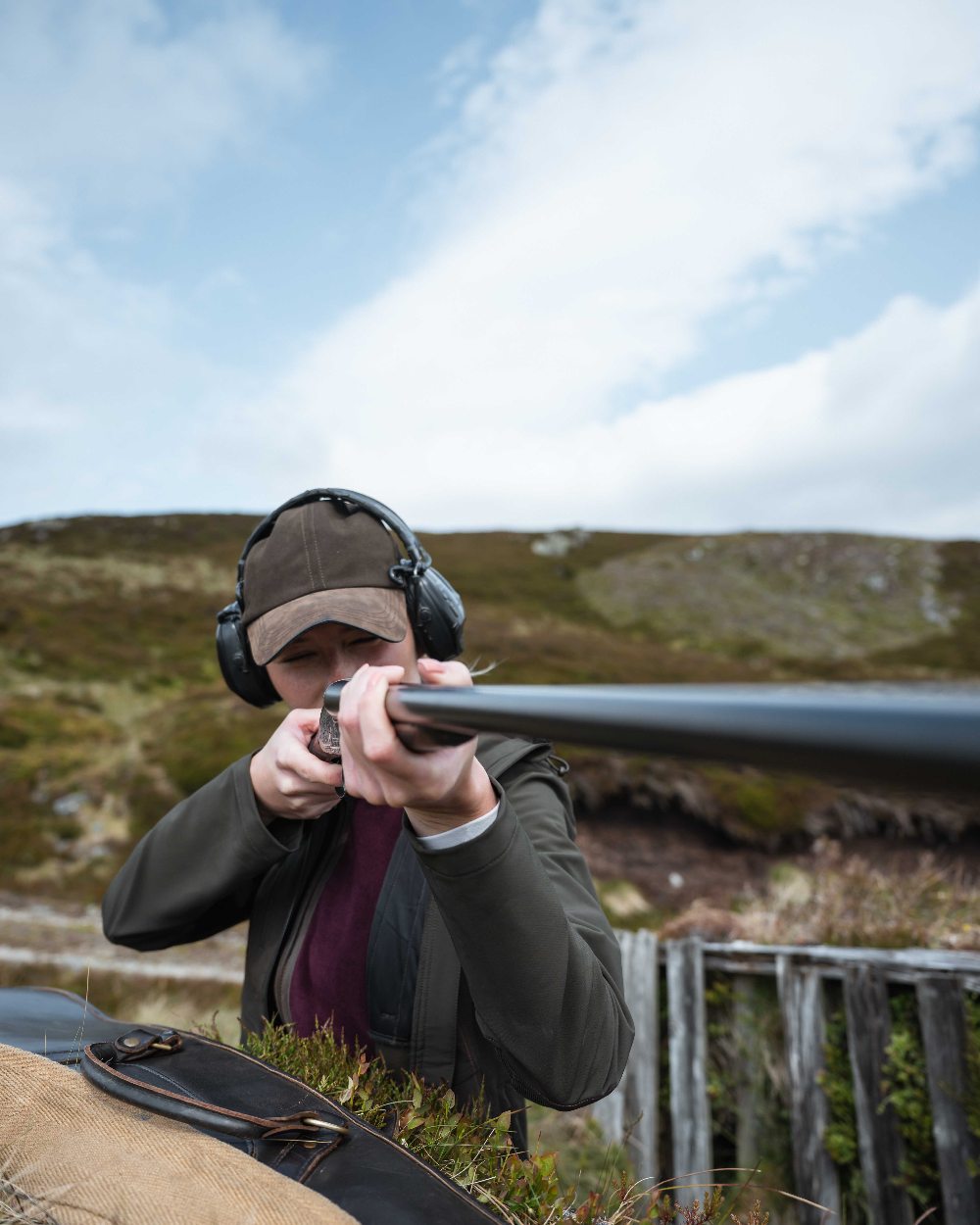 Green Coloured Hoggs of Fife Womens Ardross 4-Way Active Jacket on mountain background 