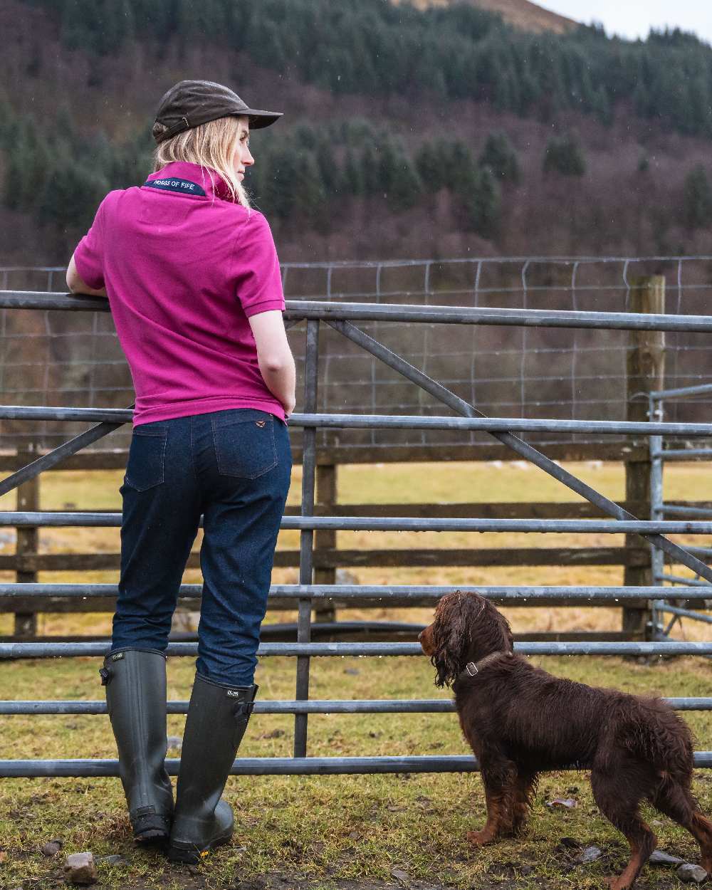 Berry Coloured Hoggs of Fife Womens Cora Pique Polo Shirt on countryside background 