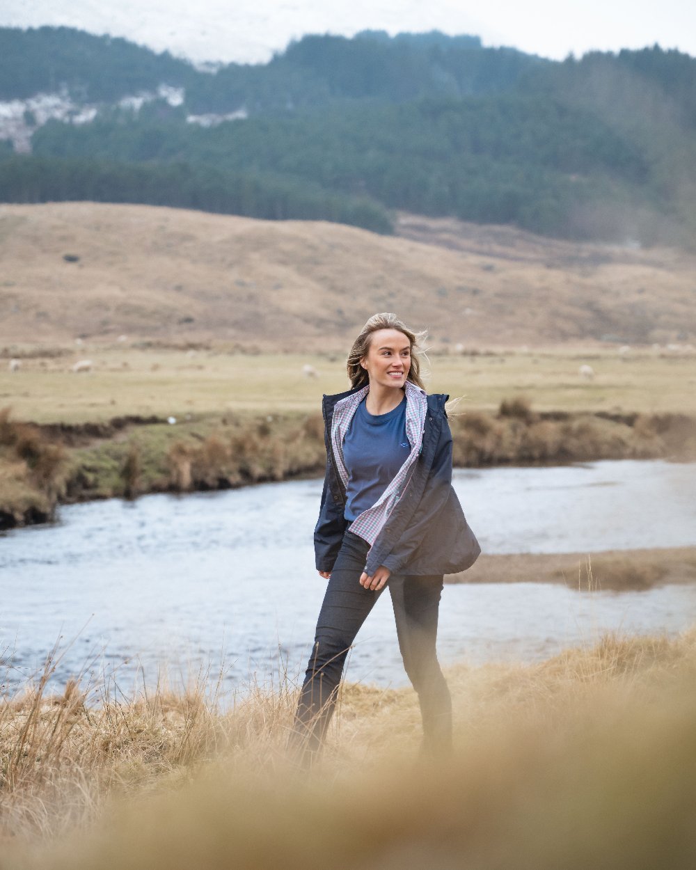 Navy Coloured Hoggs of Fife Womens Fara Waterproof Jacket on countryside background 