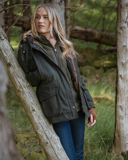 Forest Green Coloured Hoggs of Fife Womens Kelso Waterproof Waxed Jacket on outdoor background 