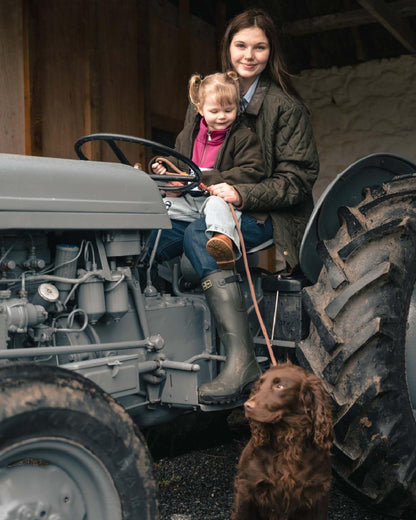 Forest Green Coloured Hoggs of Fife Womens Ladybank Quilted Jacket on outdoor background 