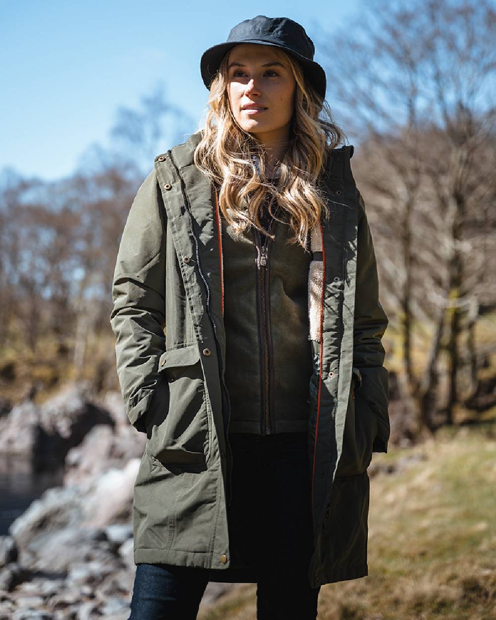 Green coloured Hoggs of Fife Womens Walker Long Coat on forest background 