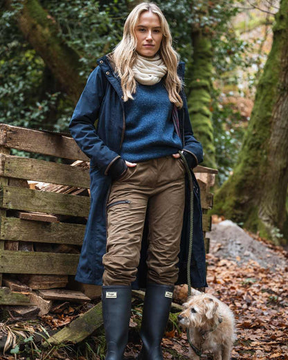 Navy coloured Hoggs of Fife Womens Walker Long Coat on forest background 