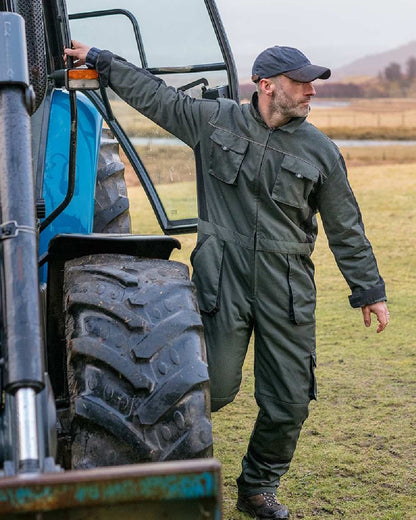 Spruce Black Coloured Hoggs of Fife Workhogg Zipped Cotton Coverall on countryside background 