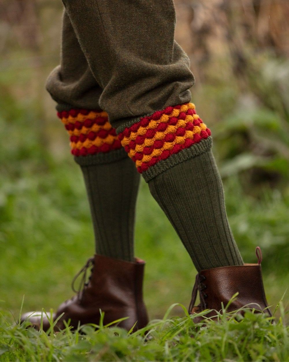 Spruce coloured House of Cheviot Angus Socks on field background 