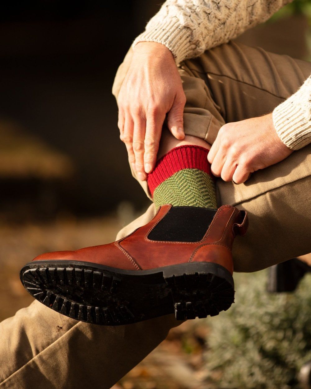 Brick Red coloured House of Cheviot Herringbone Short Socks on blurry background 