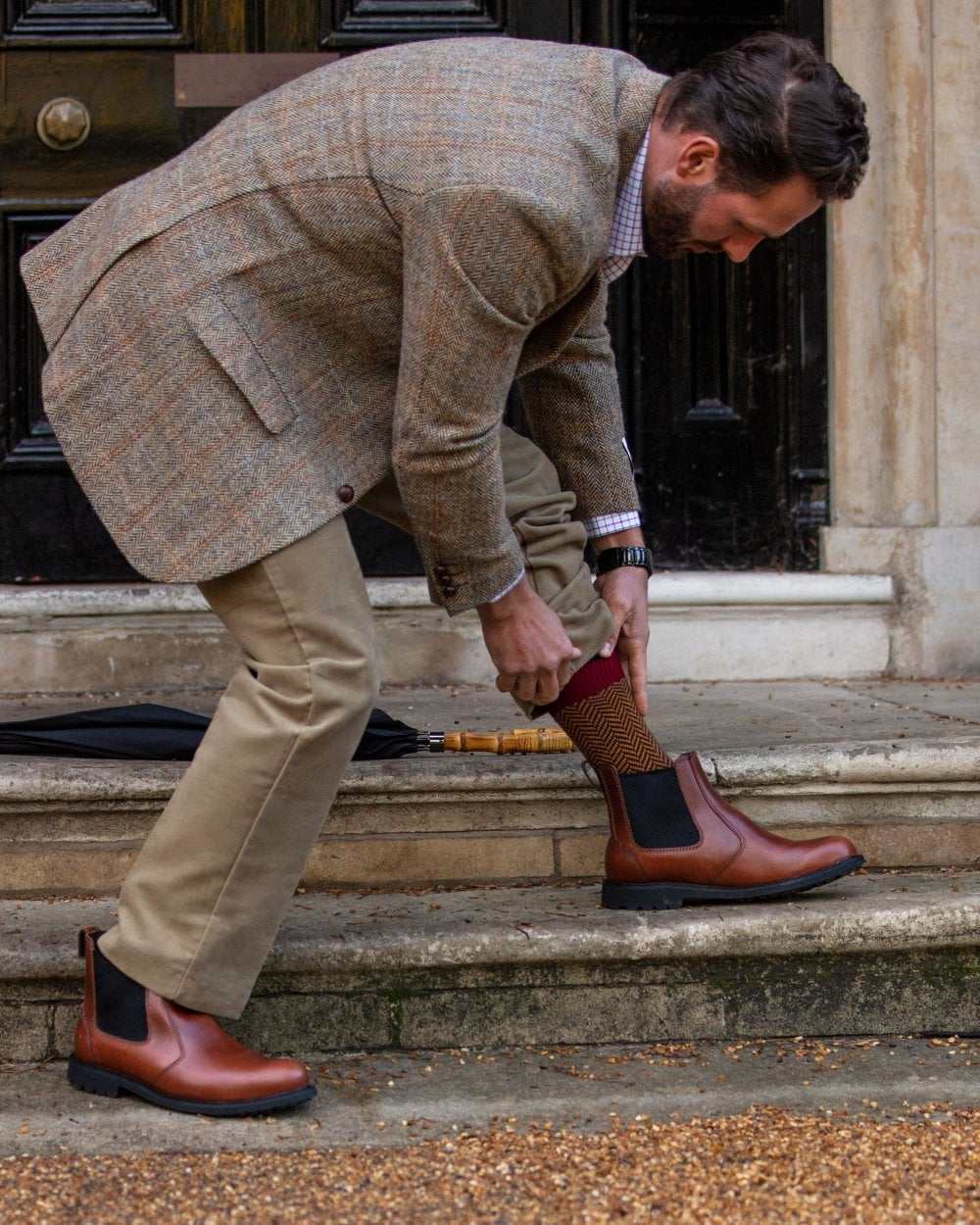 Burgundy coloured House of Cheviot Herringbone Short Socks on house background 