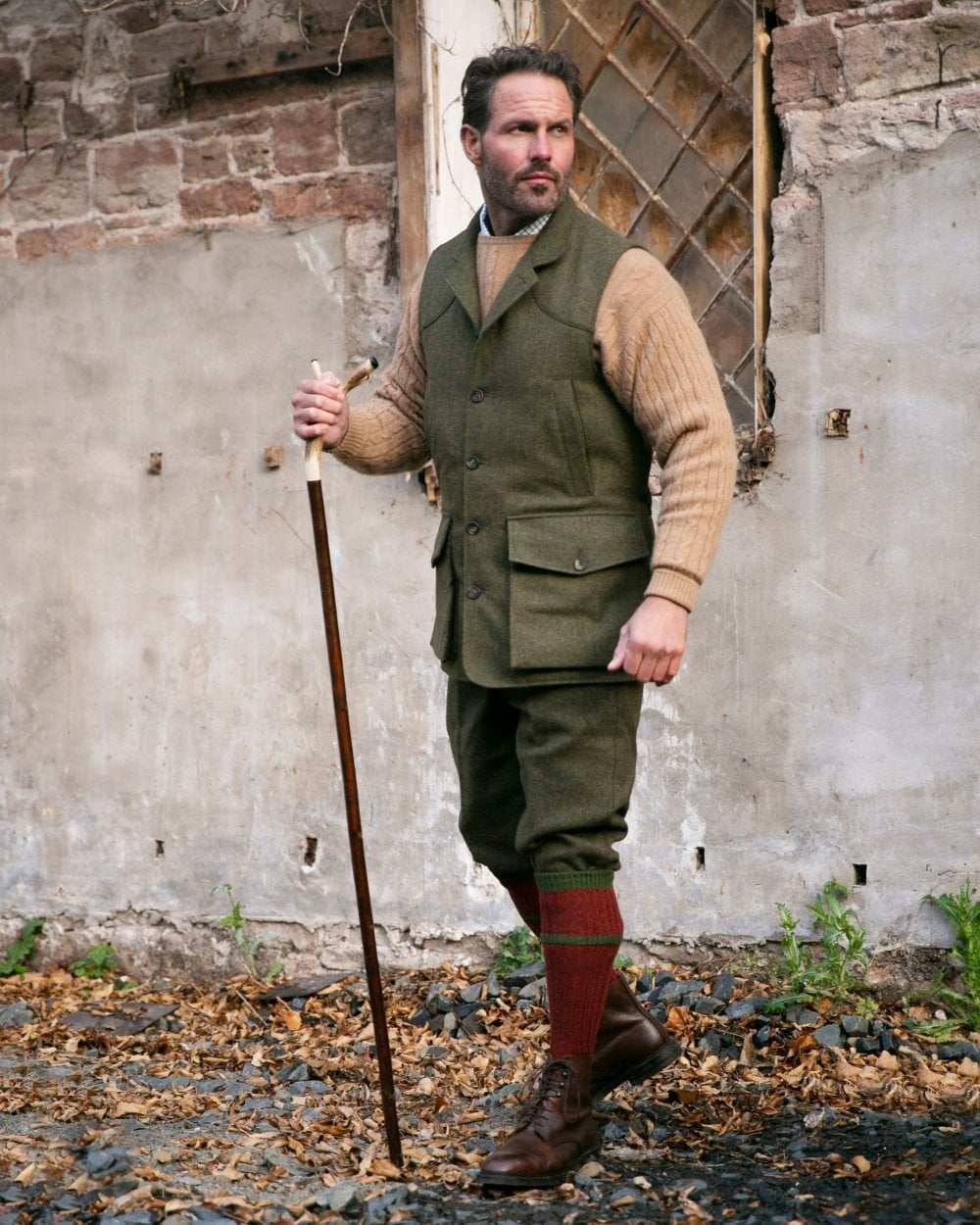 Rosehip coloured House of Cheviot Kyle Socks on wall background 