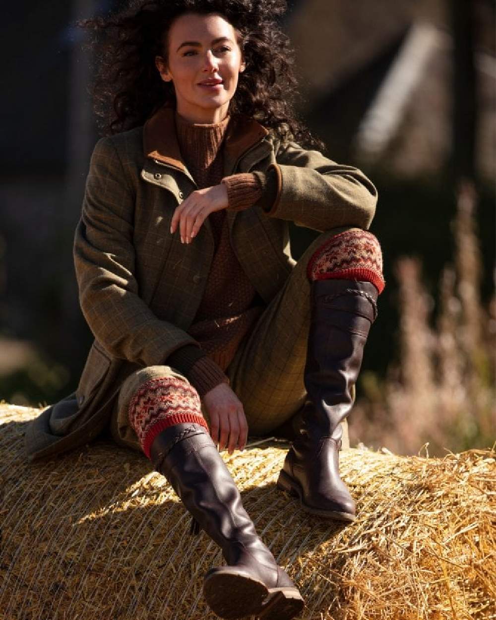 Chestnut coloured House of Cheviot Lady Fairsle Socks on blurry background 