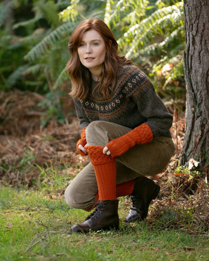 Burnt Orange coloured House of Cheviot Lady Rannoch Socks on field background 