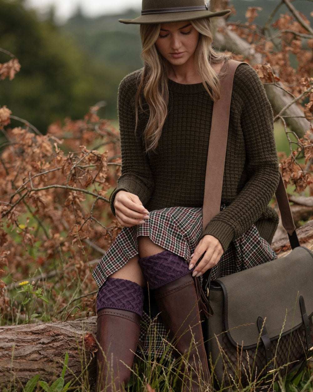 Thistle coloured House of Cheviot Lady Rannoch Socks on blurry background 