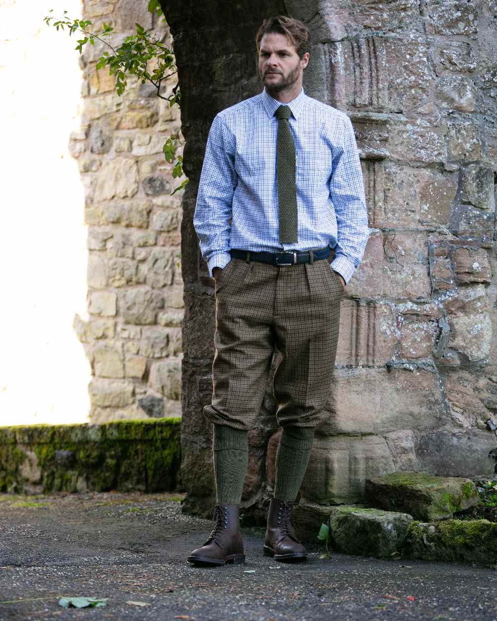 Bracken coloured House of Cheviot Scarba Socks on wall background 