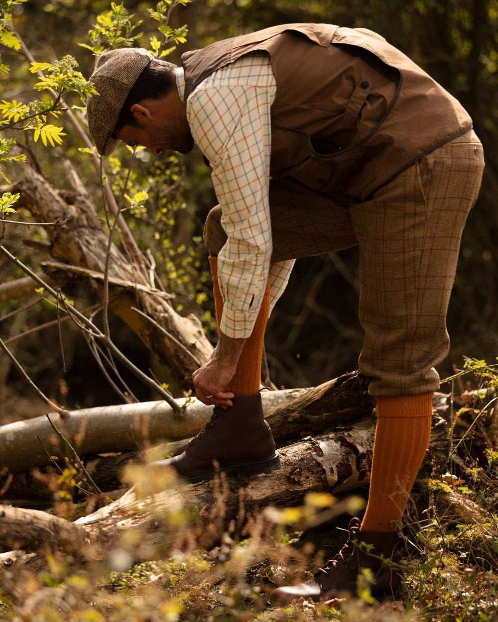 Ochre coloured House of Cheviot Scarba Socks on field background 