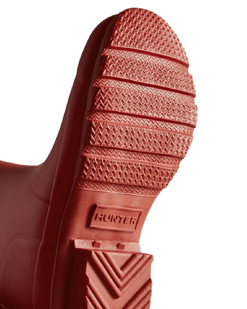 Military Red coloured Hunter Big Kids Original Wellington Boots on white background 