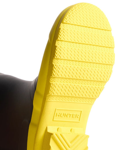Black Illuminating Yellow coloured Hunter Big Kids Original Wellington Boots on white background 