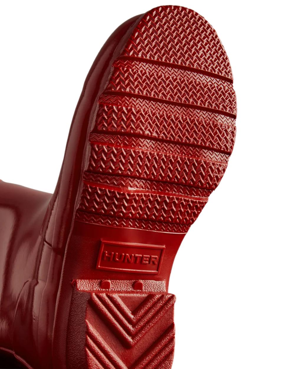 Military Red Coloured Hunter Childrens Original Gloss Wellington Boots on white background 