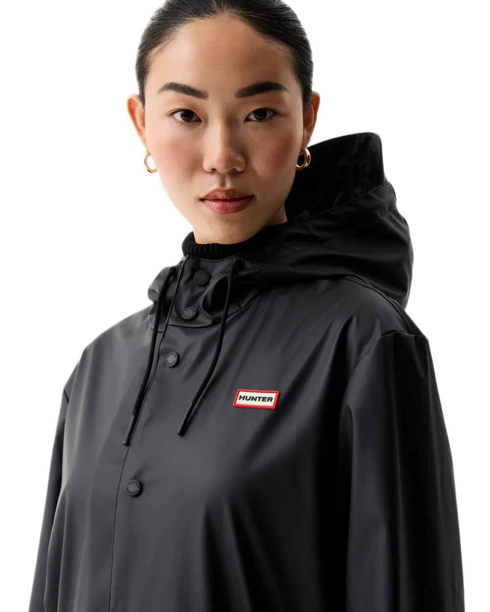 Black coloured Hunter Downpour Jo Pu Rain Parka on white background 
