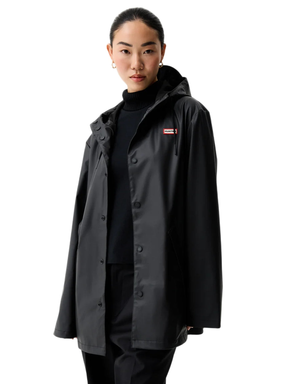 Black coloured Hunter Downpour Jo Pu Rain Parka on white background 