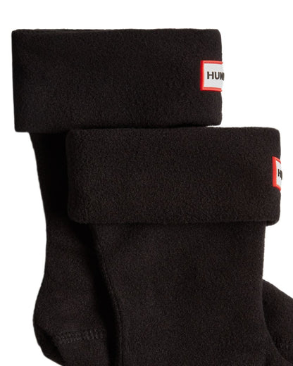 Black coloured Hunter Kids Recycled Fleece Cuff Boot Socks on white background 