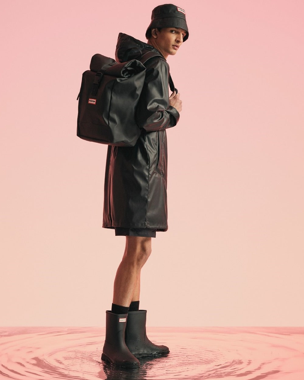 Black Coloured Hunter Mens Downpour Short Boots on water background 