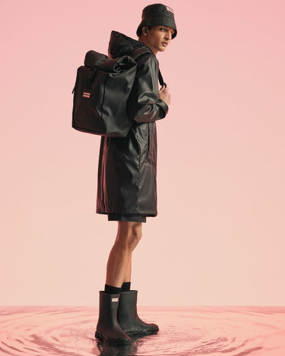 Black Coloured Hunter Mens Downpour Short Boots on water background 