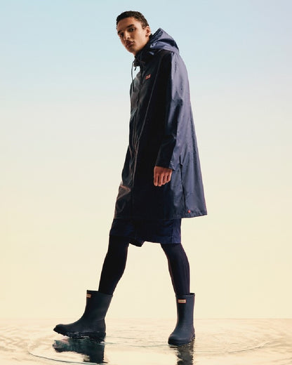 Hunter Navy Coloured Hunter Mens Downpour Short Boots on water background 