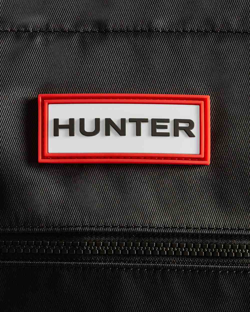 Black coloured Hunter Nylon Midi Topclip Tote Bag on white background 