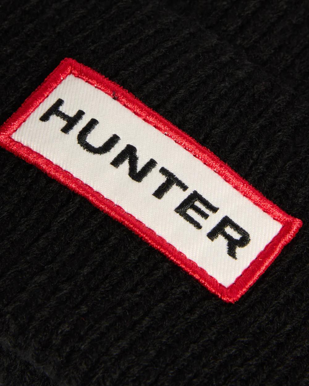 Black coloured Hunter Skye Pom Pom Beanie on white background 