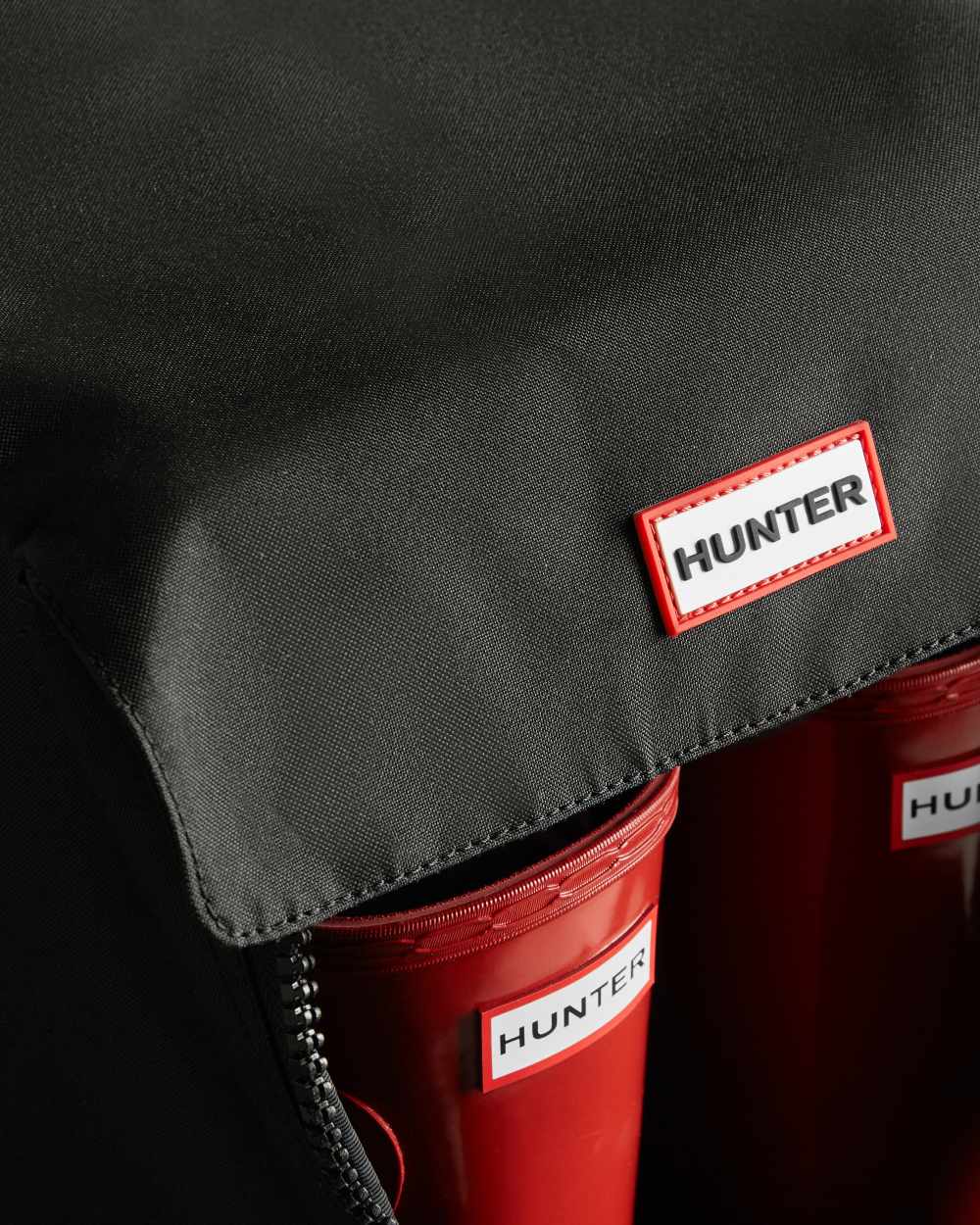 Black coloured Hunter Tall Boot Bag on white background 