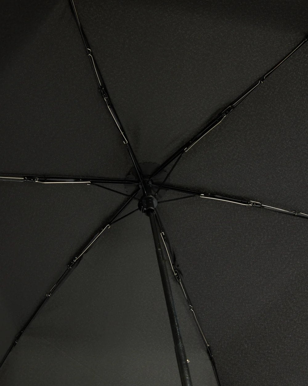 Black coloured Hunter Ultra Compact Umbrella on white background 