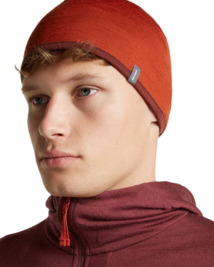 Agate Port coloured Icebreaker 200 Oasis Reversible Beanie on white background 