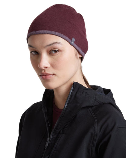 Dark Berry Grey Plum coloured Icebreaker 200 Oasis Reversible Beanie on white background 