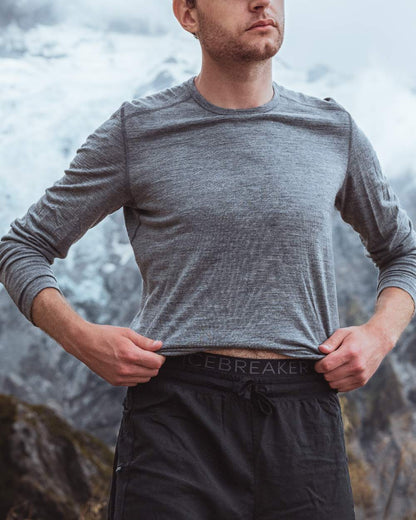 Gritstone Heather Coloured Icebreaker Mens Merino 200 Oasis Crewe Thermal Top on mountain background 