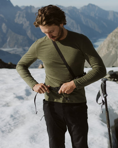 Loden Coloured Icebreaker Mens Merino 260 Tech Crewe Thermal Top on snow background 